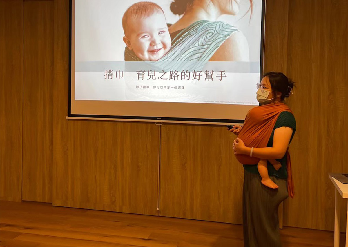 揹巾穿戴培訓內容：由學員製作分享揹巾相關簡報，主題為「揹巾：育兒之路的好幫手」。內容涵蓋揹巾對母乳餵養、行動力提升及產後心理健康的積極影響。